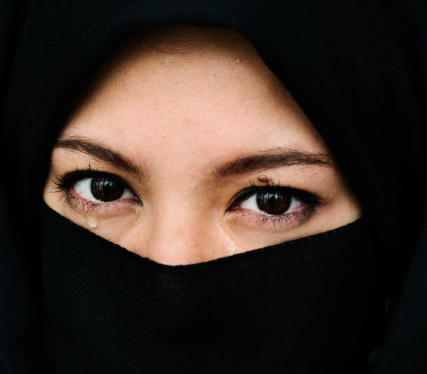 istock Middle eastern woman wearing hijab studio portrait 696544654