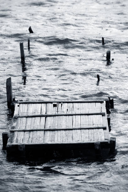istock wooden destroyed bridge in a rain 696544898