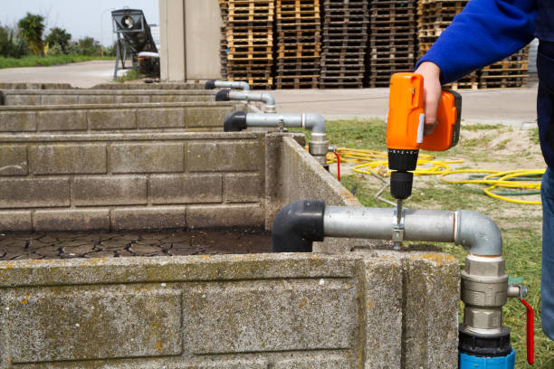 istock plumber at work in wastewater treatment plant 696545382