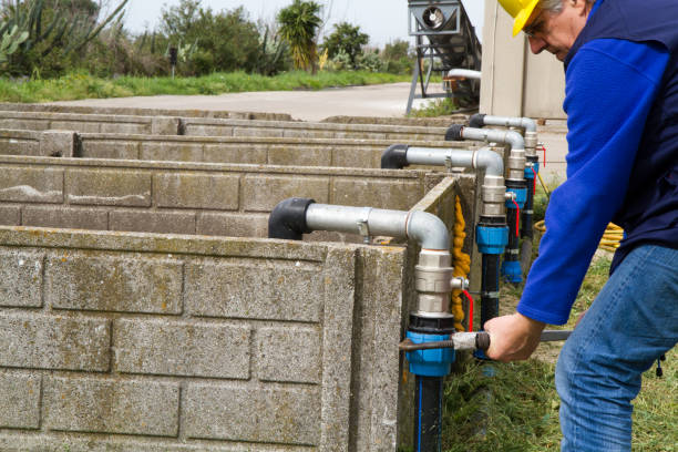 istock plumber at work in wastewater treatment plant 696545494