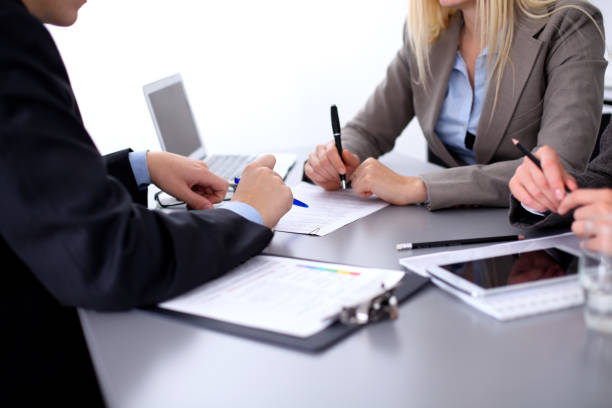 istock Group of business people working together in office 696551938