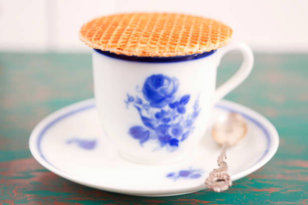 istock Cup of coffee with a Dutch stroopwafel cookie 696552688