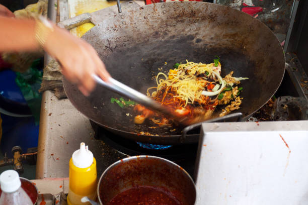 istock Frieing noodles with vegetables and meat 696552692