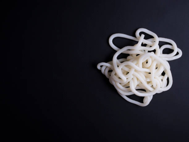 istock Udon noodles from Korea isolated on black 696553192