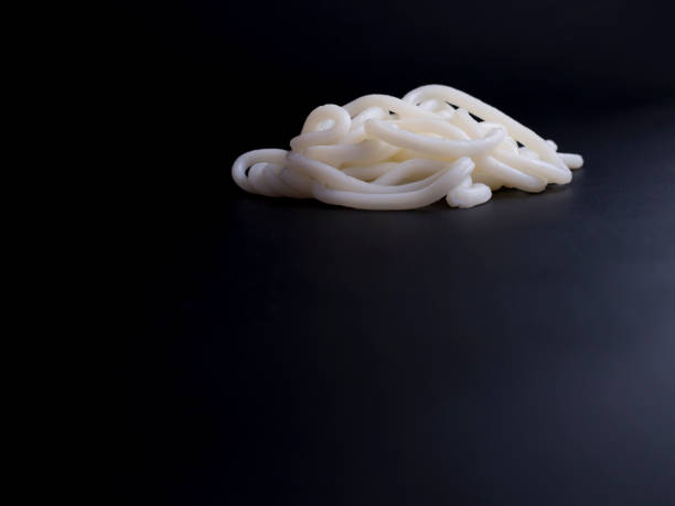 istock Udon noodles from Korea isolated on black 696553224