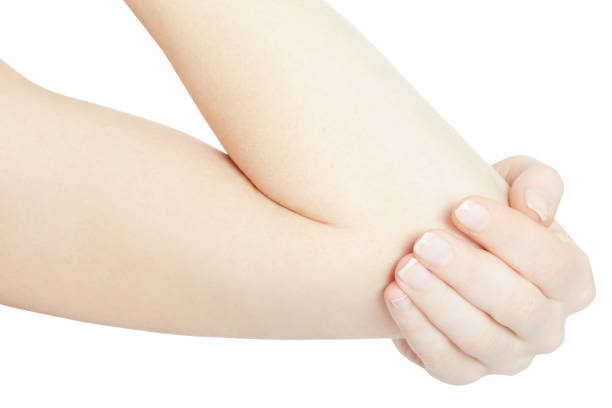 istock Woman hand holding painful elbow on white, clipping path 696556944