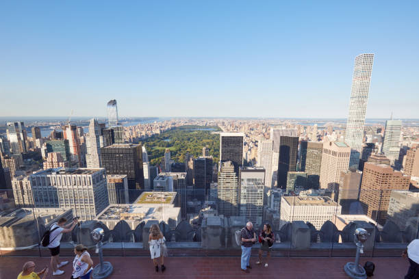 New York - September 12: Rockefeller Center observation deck with people, Central Park and city skyline view in a sunny day. The terrace on top of the skyscraper is called \