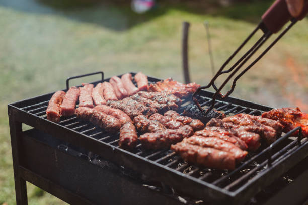 istock Meat on a barbecue stove. 696557416