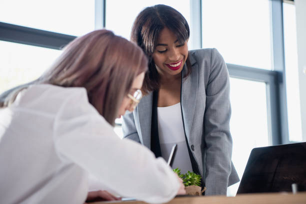 istock young smiling multiethnic designers working at office together 696561710