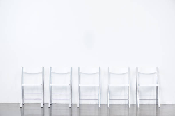 istock row of smart chairs at white waiting room 696561858