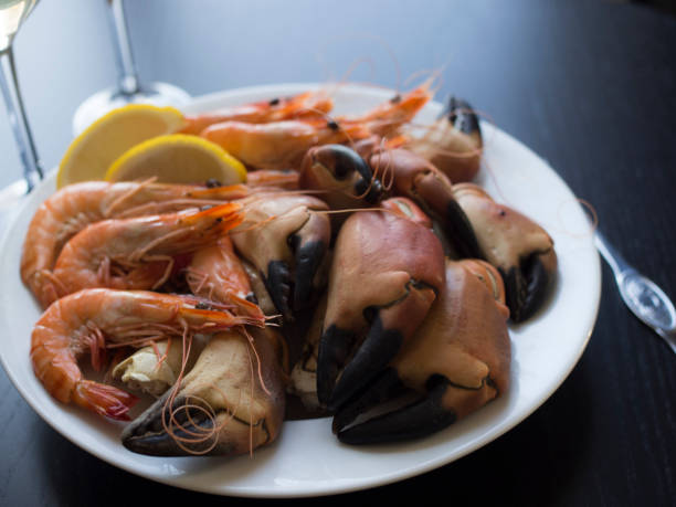 istock Seafood plate with crab claws and prawns 696565332