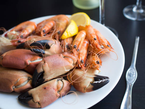 istock Seafood plate with crab claws and prawns 696565346