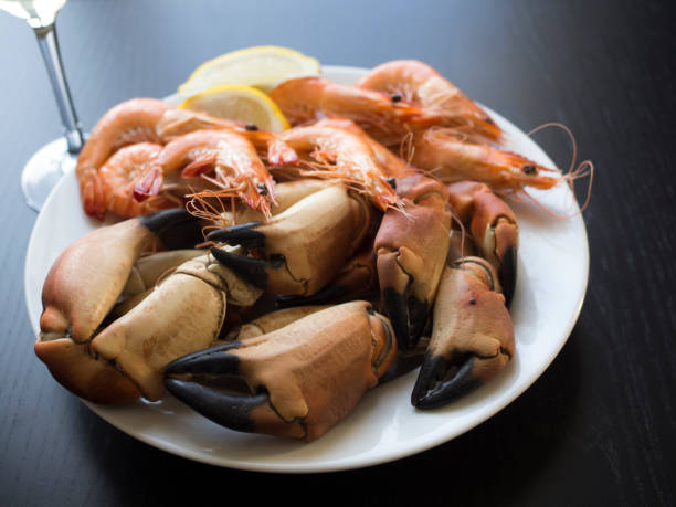 istock Seafood plate with crab claws and prawns 696565356