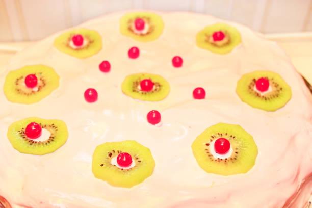 birthday cake decorated with kiwi and berries of Viburnum
