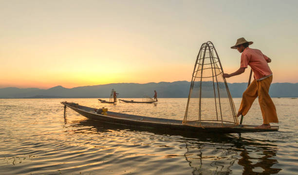 istock Three fisherman at Inle Lake, Myanmar. 696578824