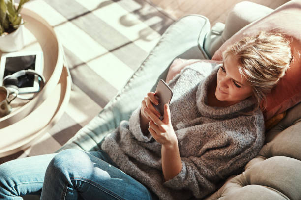 istock Even at home she's never far from what's happening 696580218
