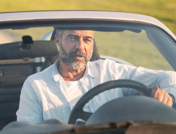 istock Mature man at car 696584526