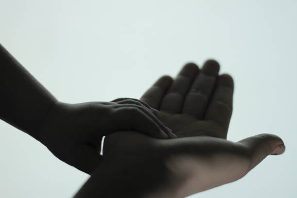 istock A child is holding his mother's hand 696586272