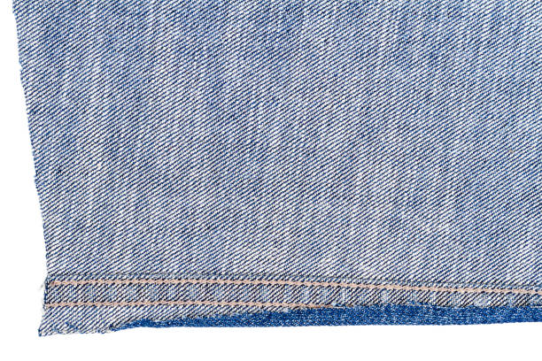 istock Piece of blue jeans fabric 696589196