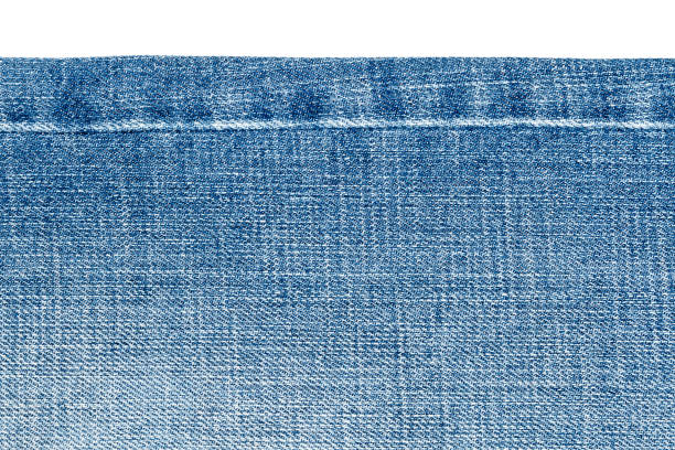 istock Piece of light blue jeans fabric 696589584