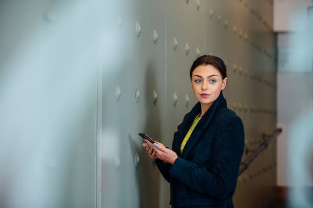 istock Businesswoman Using Smartphone 696597450