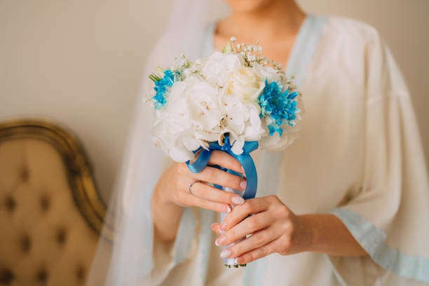 istock Wedding bouquet in hands of the bride 696600930