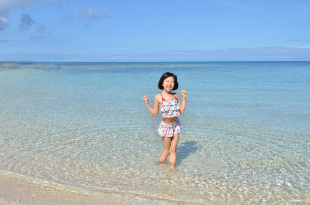 istock A girl on the beach 696601646
