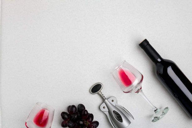 istock Wine, glasses and corkscrew over white background. Top view 696604842