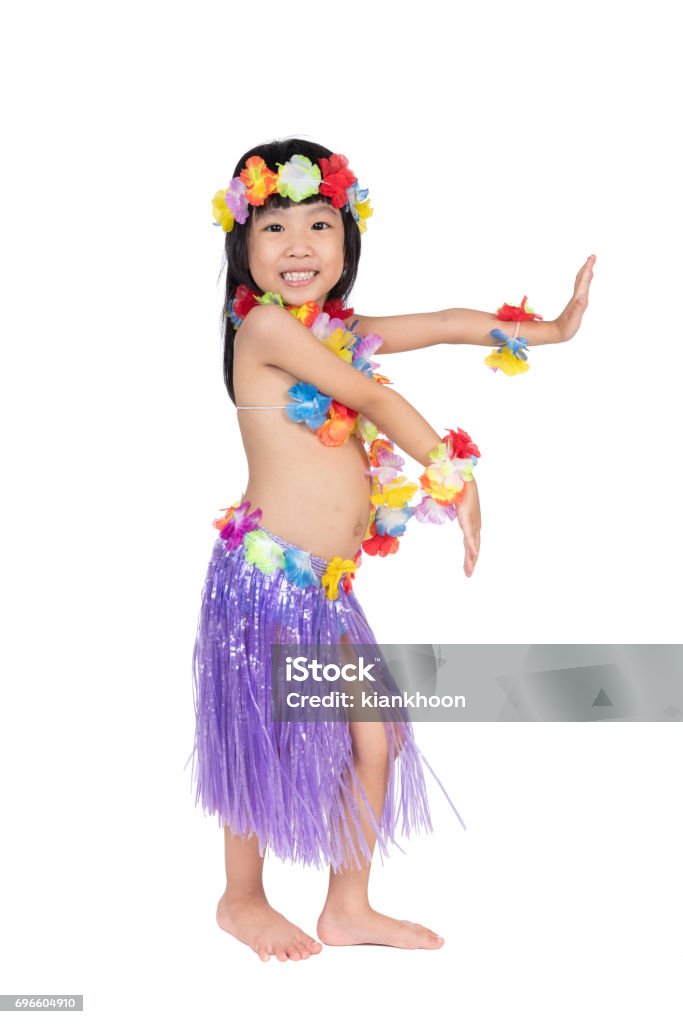 Asian Chinese little girl in hawaiian costume Asian Chinese little girl in hawaiian costume pretending to be a Hula Dancer in isolated white background Arts Culture and Entertainment Stock Photo