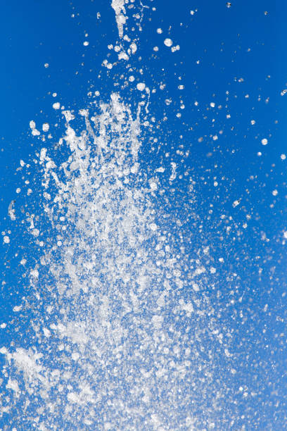istock Splashing water against the blue sky 696605136
