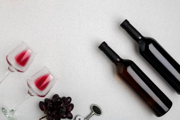 istock Two glasses of red wine and grapes. Top view 696605376