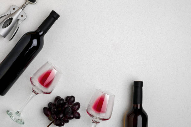 istock Two glasses of red wine and grapes. Top view 696605462