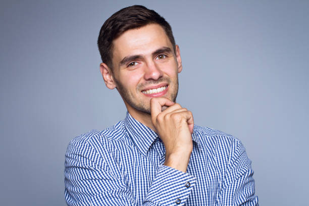istock Happy smiling business man, isolated over gray background 696606032