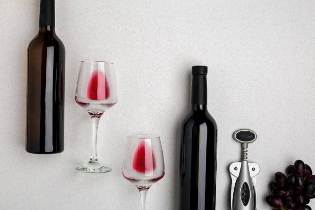 istock Two glasses of red wine and grapes. Top view 696608308