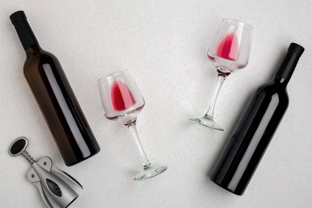 istock Two glasses of red wine and grapes. Top view 696608492