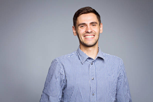 istock Happy smiling business man, isolated over gray background 696608606