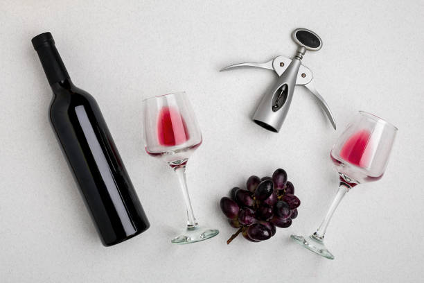 istock Wine, glasses and corkscrew over white background. Top view 696608640