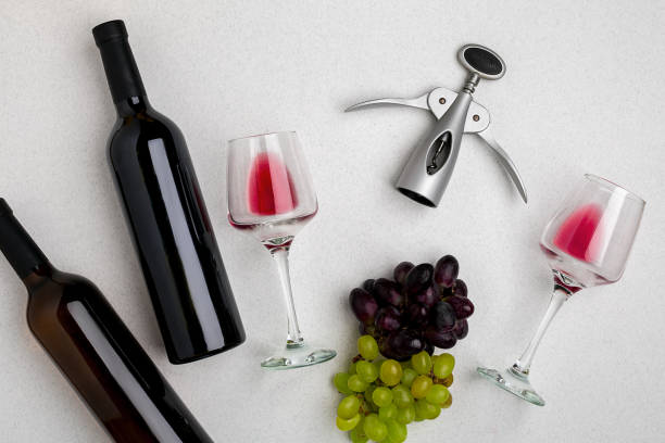 istock Two glasses of red wine and grapes. Top view 696608848