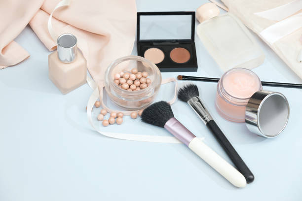 istock Frame from set of professional decorative cosmetics, makeup tools and accessory on blue background copy space for your text. flat lay frame composition, top view 696609582