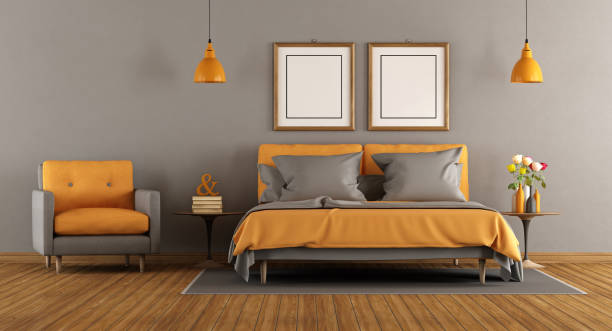 istock Modern gray and orange bedroom 696609614