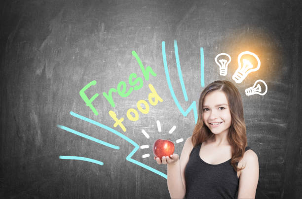 girl with apple and food idea, blackboard - girl5 imagens e fotografias de stock