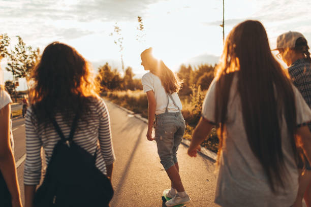 istock Girls on a way from school 696620278