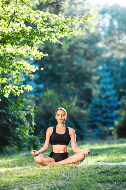 istock Attractive girl doing yoga 696620478