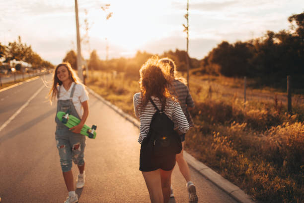istock Girls on a way from school 696620500