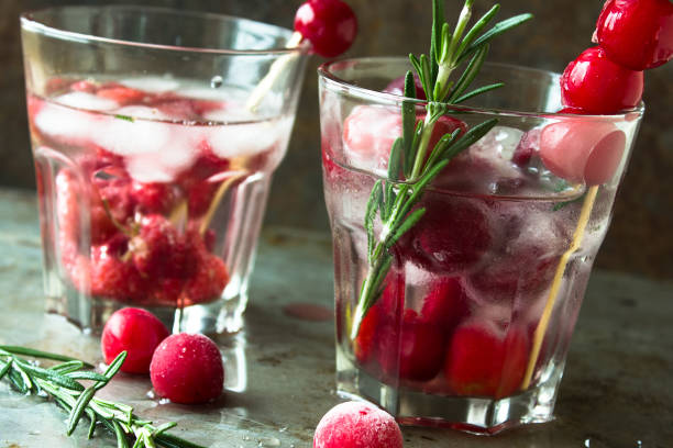 istock Glasses with fresh organic detox berry water on gray surface 696620780