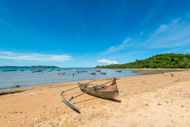 Traditional boat, Nosy Be, Madagascar Traditional pirogue on the shore of Nosy Be island in Madagascar, Africa. madagascar beach photos stock pictures, royalty-free photos & images