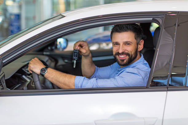 istock Happy young man with his new car 696631262