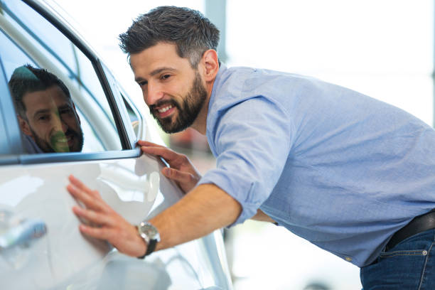 istock Happy young man with his new car 696631352
