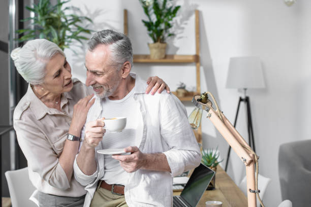 istock Loving senior couple converse together 696638940