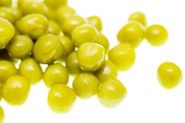 istock Pickled green peas isolated on white background 696639024